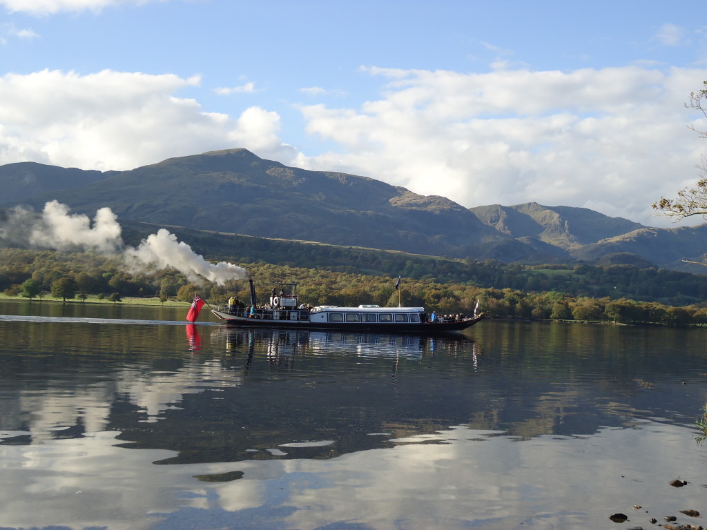 Gondola near Brantwood on lake coniston, with old man in background, October 2014