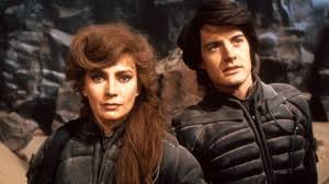 Paul Atreides (Kyle MacLachln) and his mother Jessica (Francesca Annis). Note the elaborate hair-do in the middle of a howling desert.