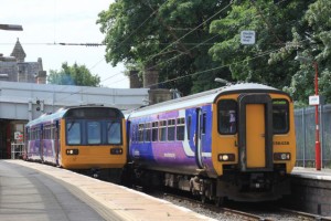 Pacer train (on left) at Lancaster. Real train on right.